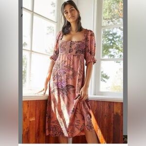 Floral Anthropologie midi smocked dress with puffed sleeves